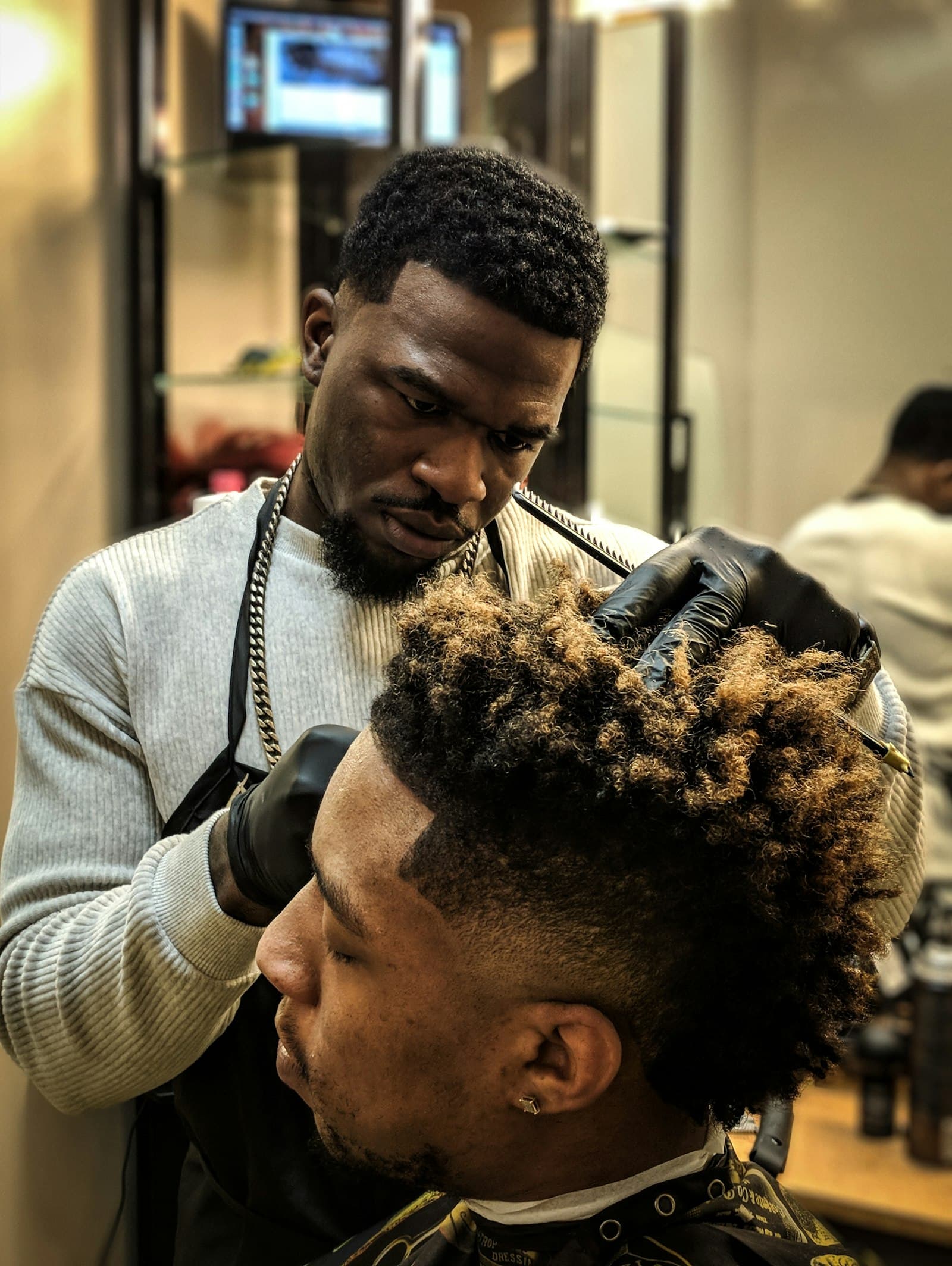 Skin fade with textured curls on top